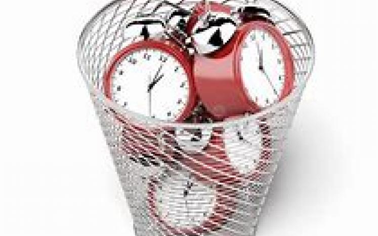 trash can full of clocks